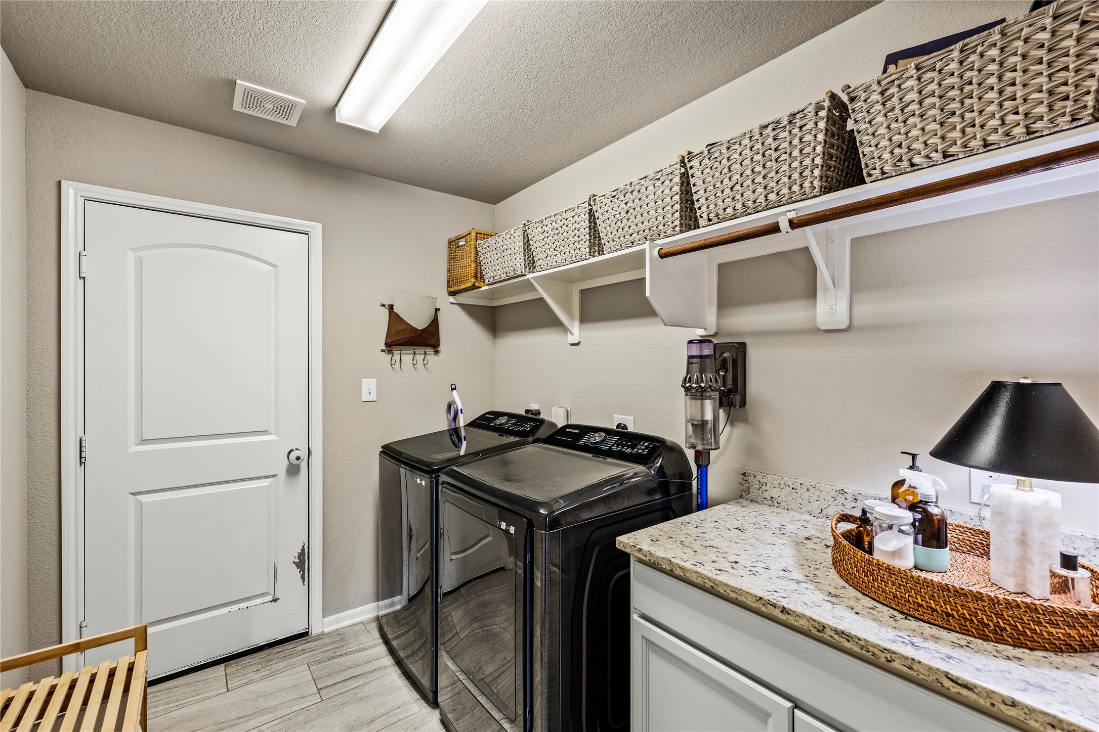114 Dudley Road Montgomery, TX 77356 - Photo 28 of 49 Generous laundry room with additional hanging space and counter space with storage.