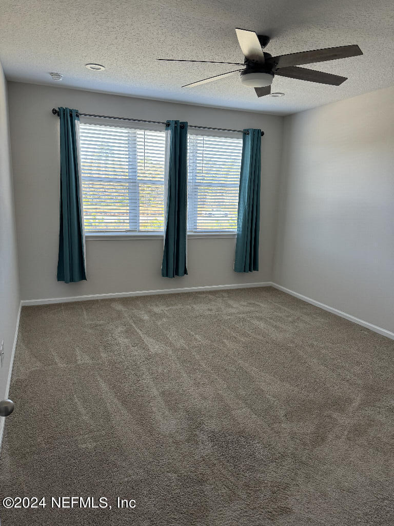 168 Pine Bluff Drive St. Augustine, FL 32092 - Photo 6 of 12 a view of an empty room with a window