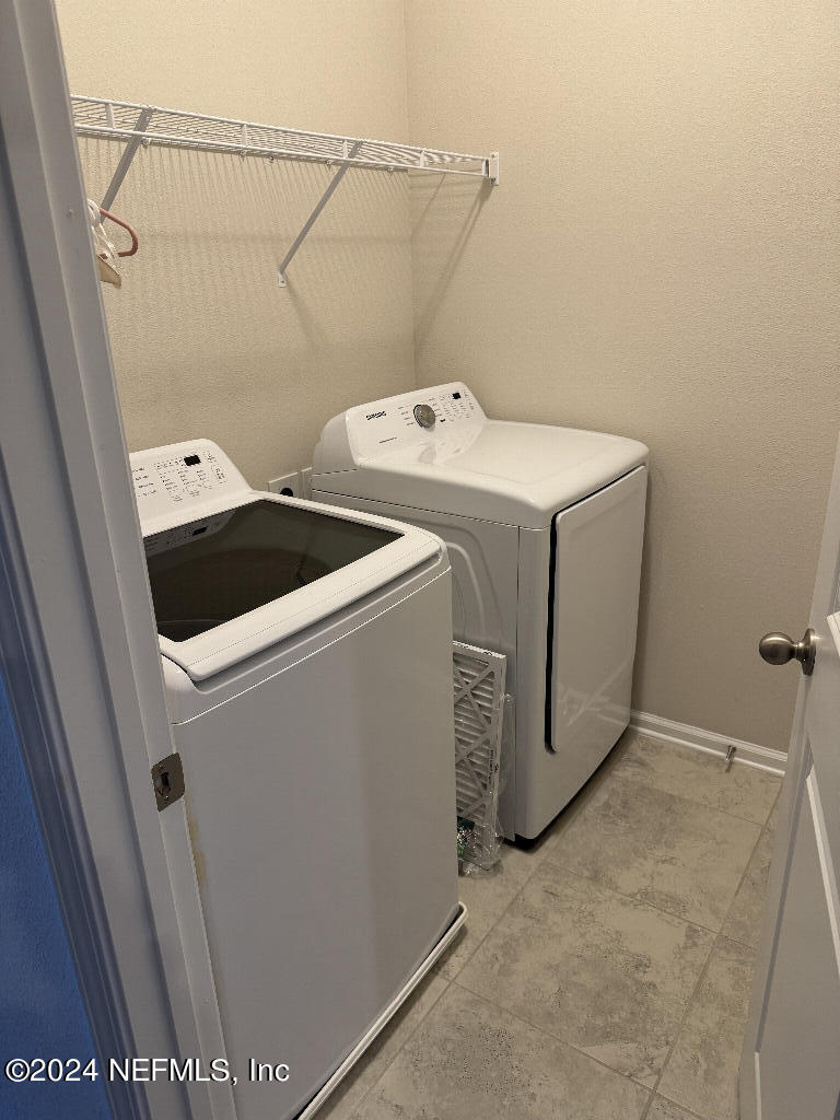 168 Pine Bluff Drive St. Augustine, FL 32092 - Photo 8 of 12 a utility room with dryer and washer