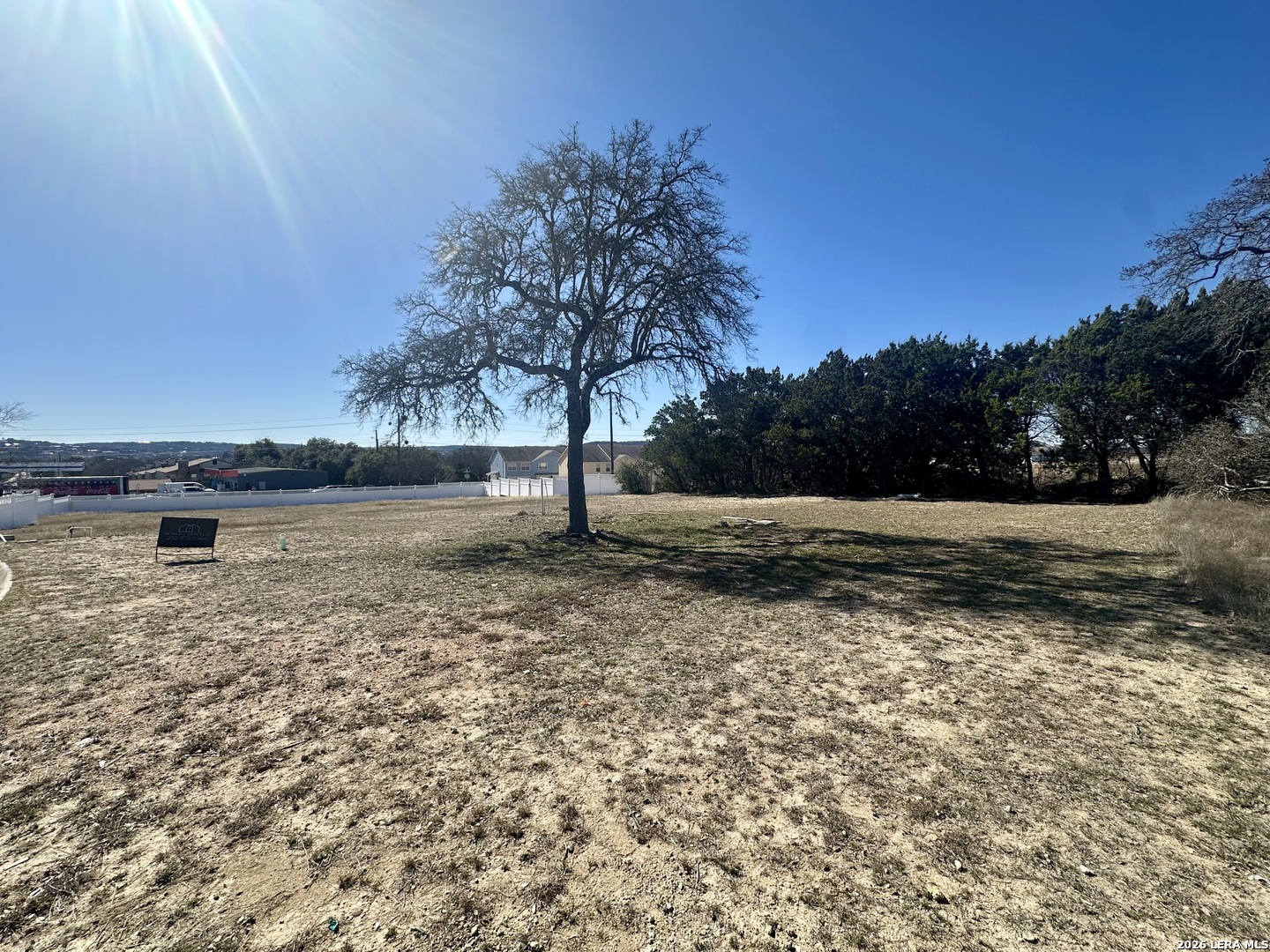 704 Sendero Ridge Dr. Kerrville, TX 78028 - Photo 2 of 3 a view of a lake with a yard