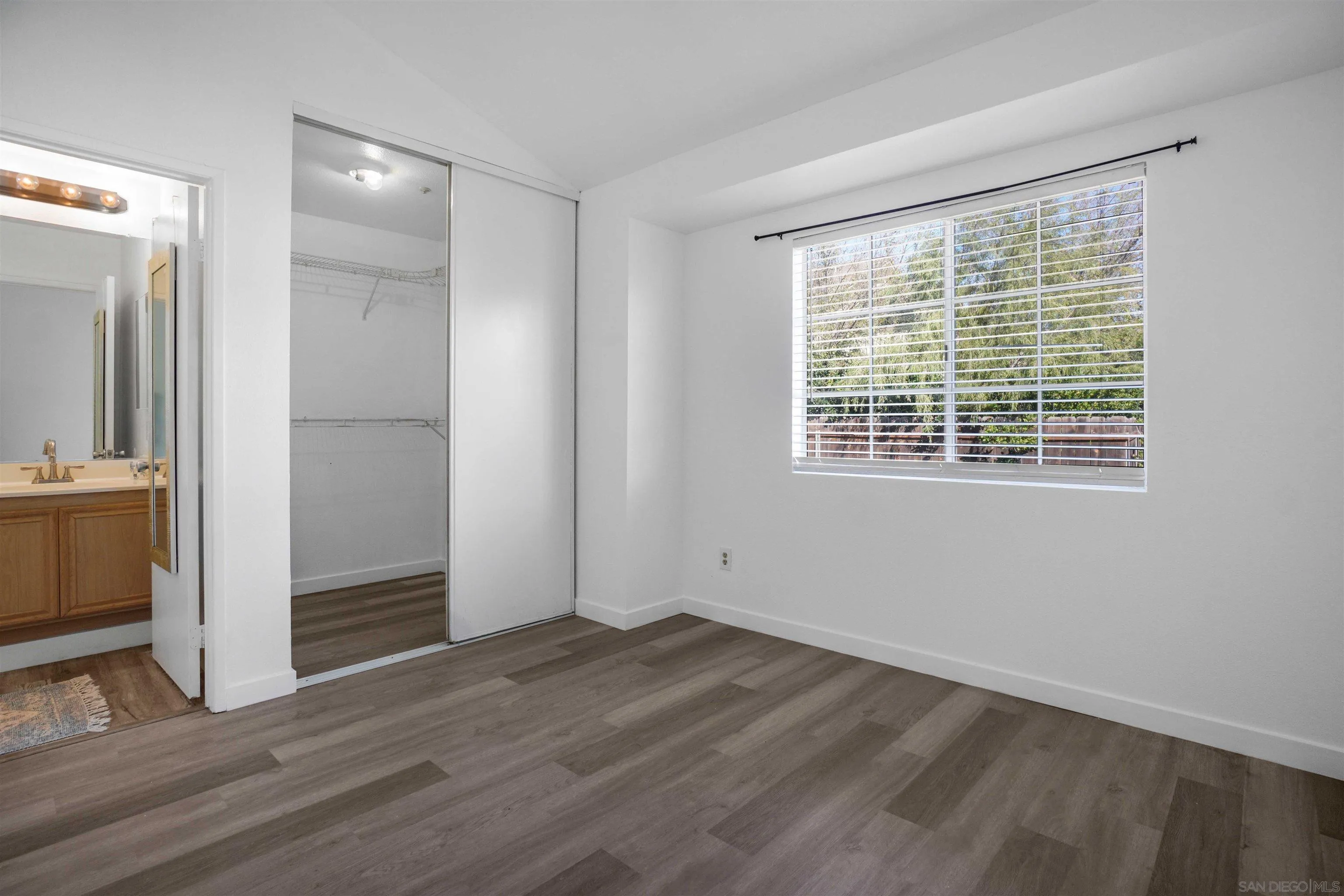 8966 Arlingdale Way Spring Valley, CA 91977 - Photo 12 of 24 a view of wooden floor and windows in a room