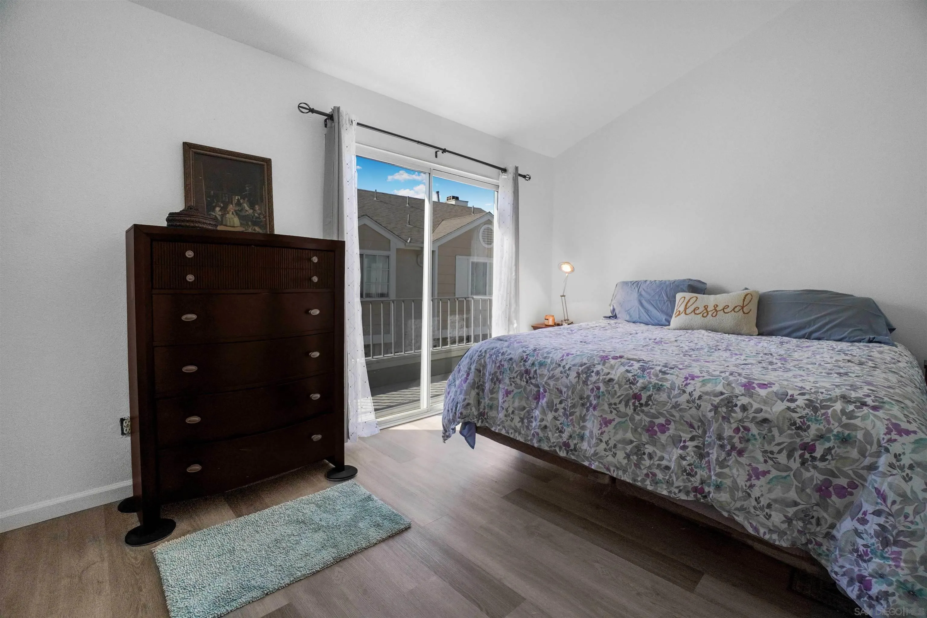 8966 Arlingdale Way Spring Valley, CA 91977 - Photo 15 of 24 a bedroom with a bed and a window
