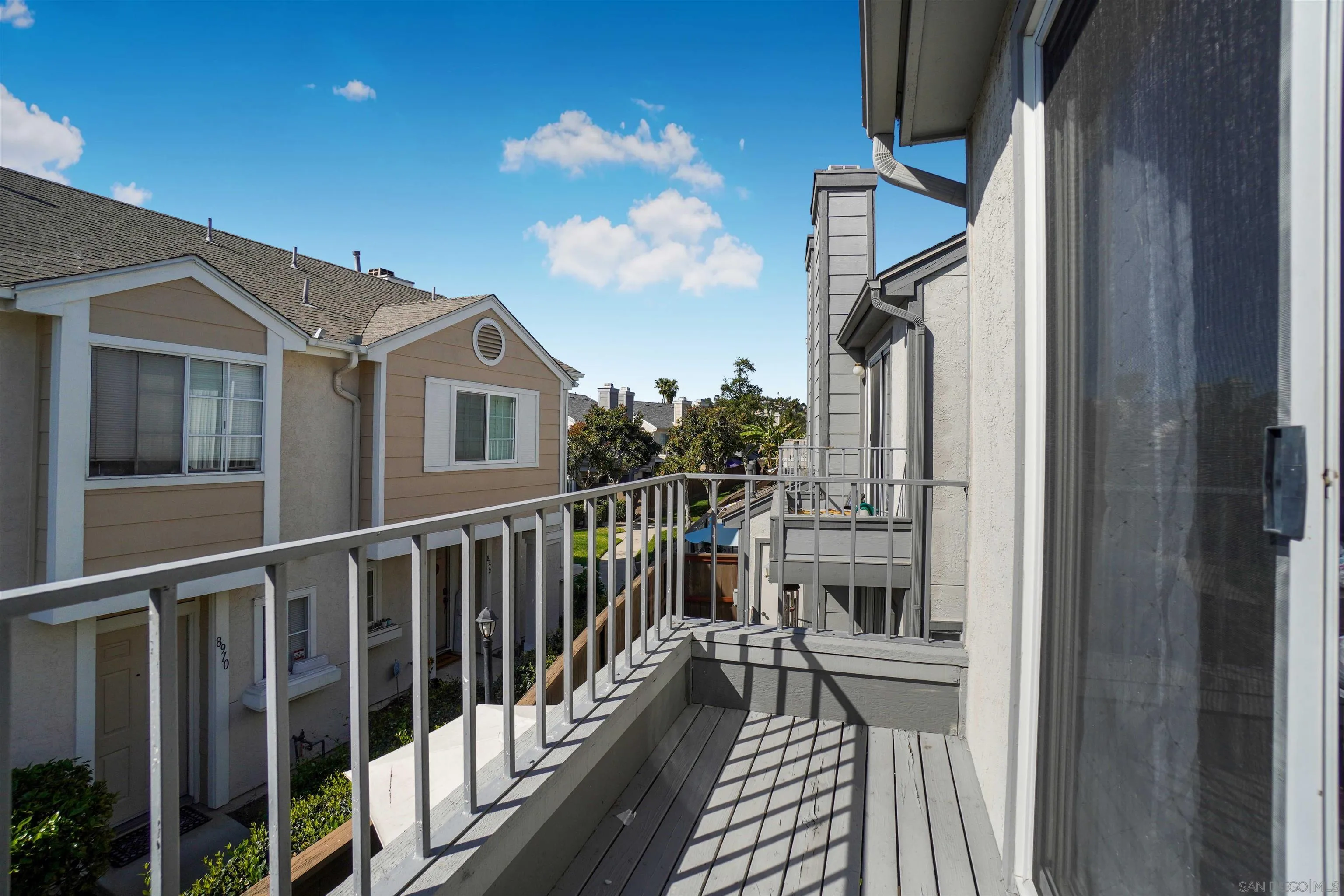 8966 Arlingdale Way Spring Valley, CA 91977 - Photo 19 of 24 a view of a balcony with wooden floor and fence