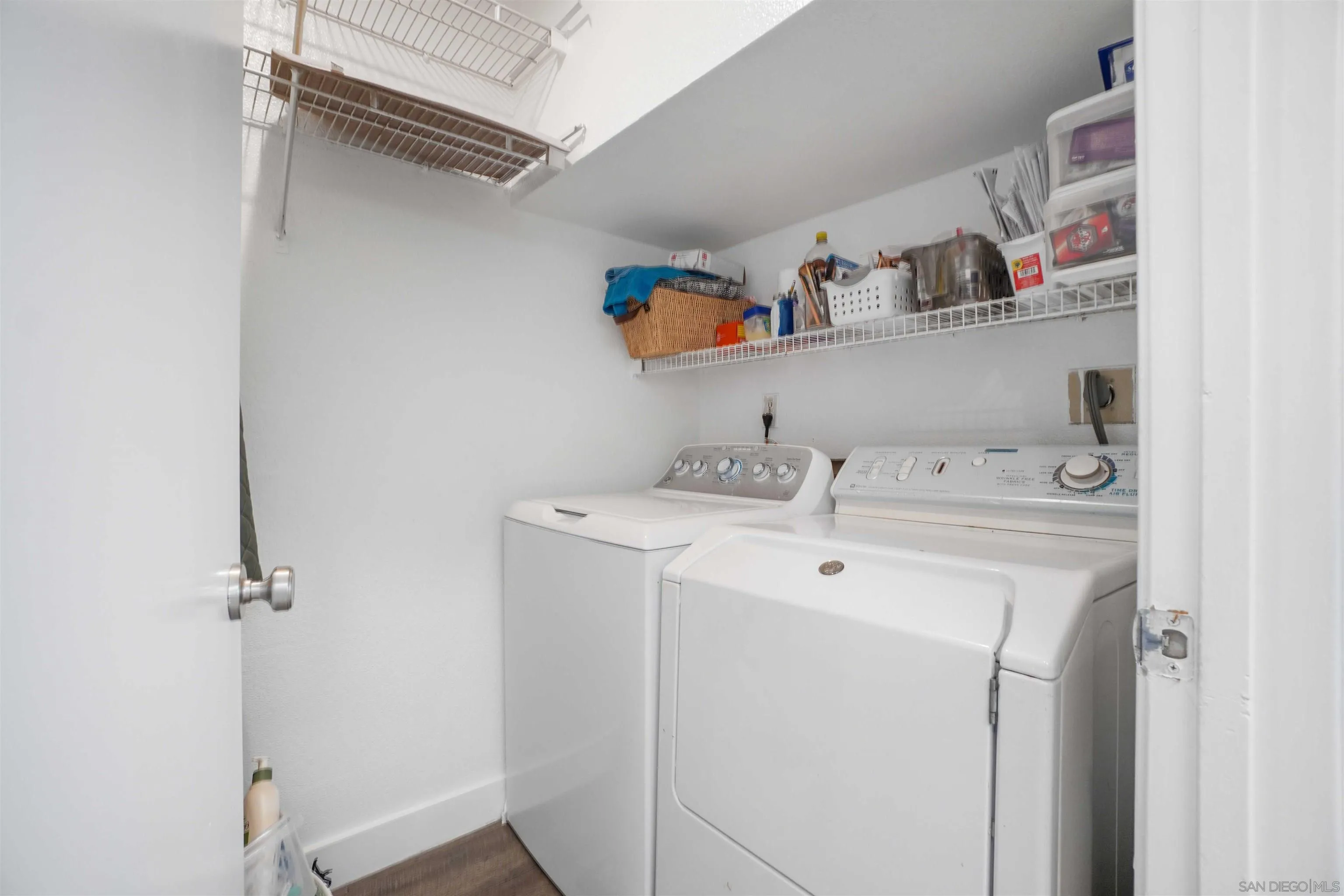 8966 Arlingdale Way Spring Valley, CA 91977 - Photo 6 of 24 a utility room with dryer and washer
