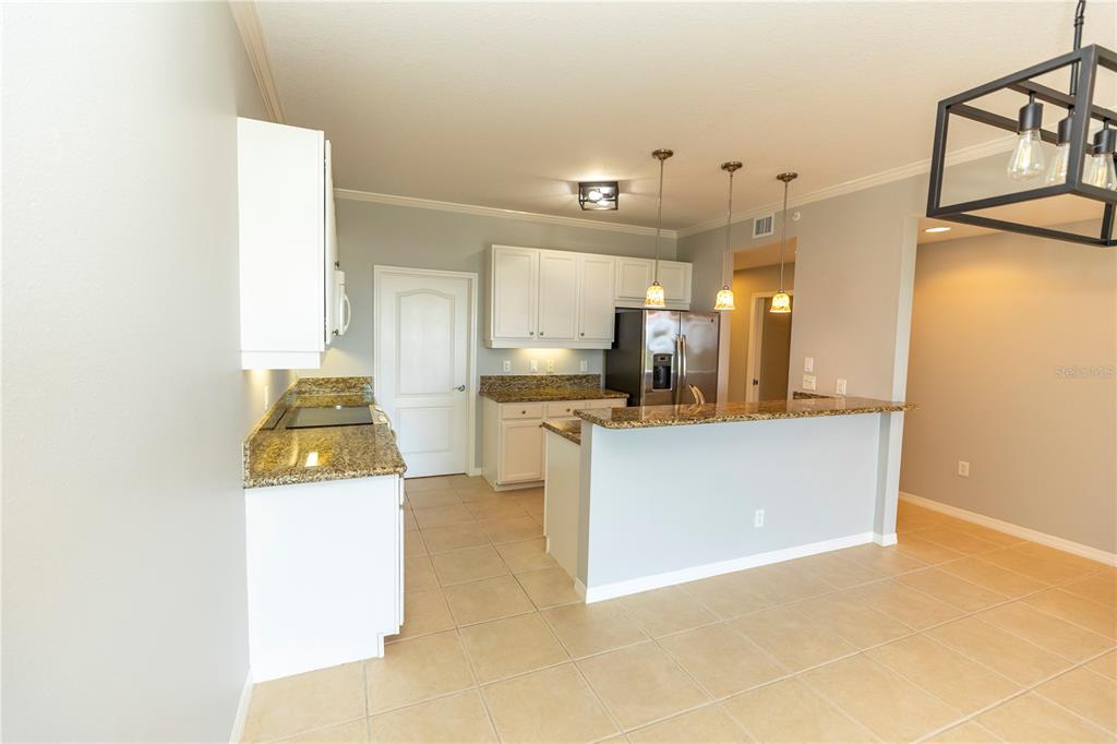 9203 Griggs Road, Unit B102 Englewood, FL 34224 - Photo 16 of 66 a view of kitchen and kitchen with a sink