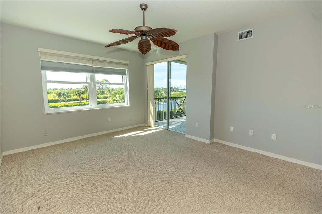 9203 Griggs Road, Unit B102 Englewood, FL 34224 - Photo 19 of 66 a view of an empty room with a window