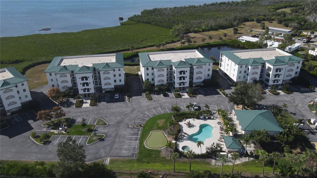 9203 Griggs Road, Unit B102 Englewood, FL 34224 - Photo 2 of 66 an aerial view of a house with a swimming pool patio and outdoor seating