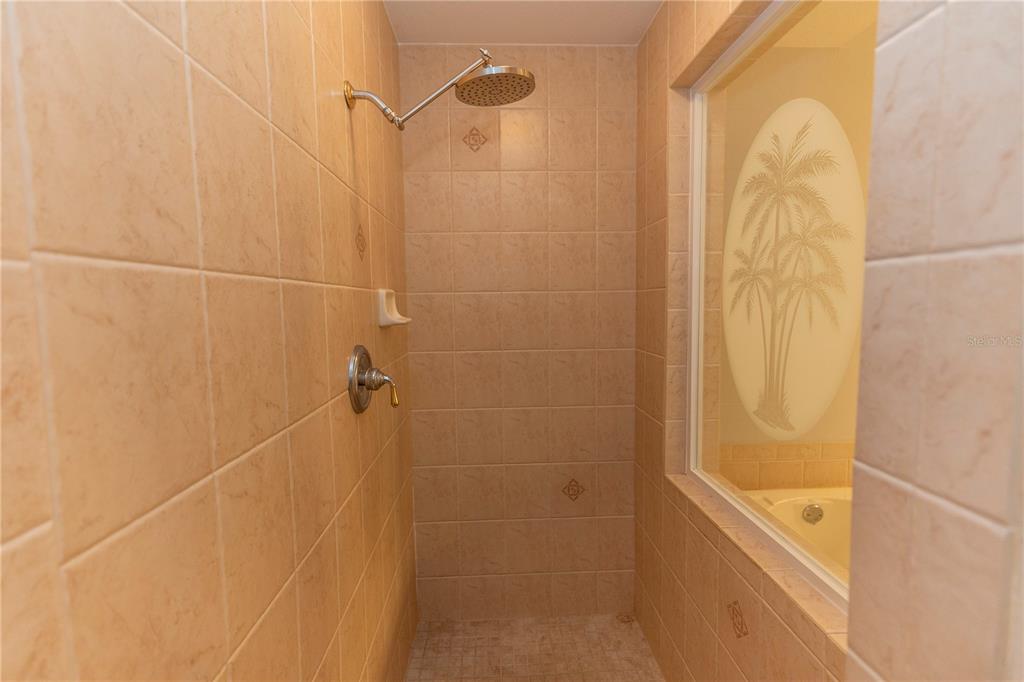9203 Griggs Road, Unit B102 Englewood, FL 34224 - Photo 24 of 66 a bathroom with a shower