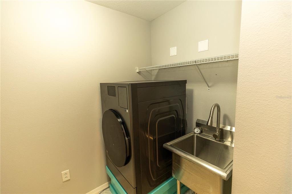 9203 Griggs Road, Unit B102 Englewood, FL 34224 - Photo 27 of 66 a close view of sink and tap