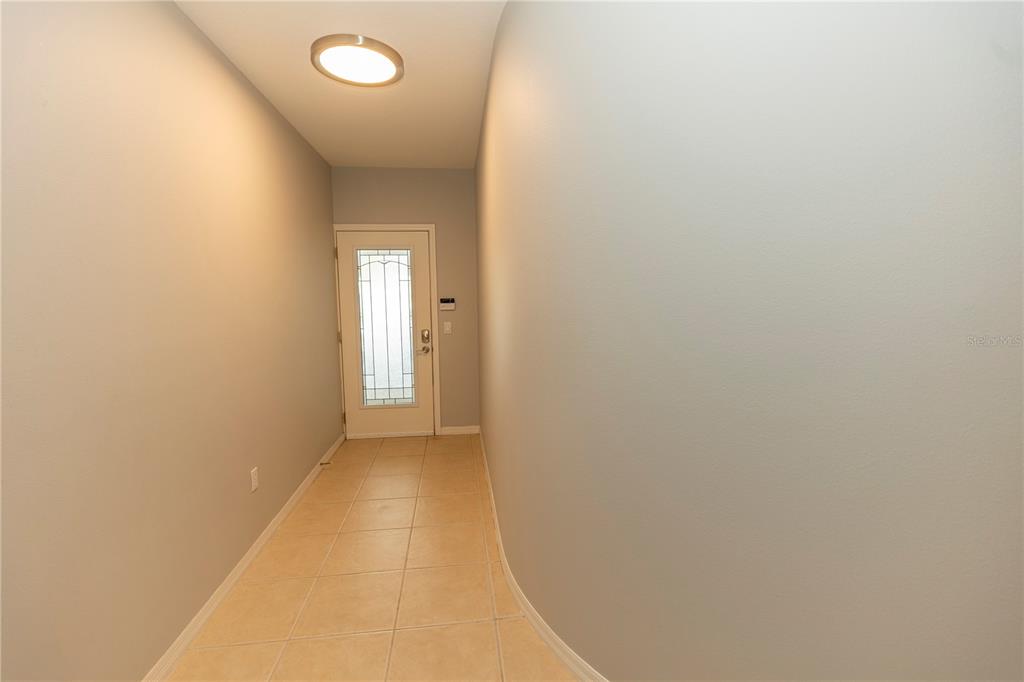 9203 Griggs Road, Unit B102 Englewood, FL 34224 - Photo 4 of 66 a view of a hallway