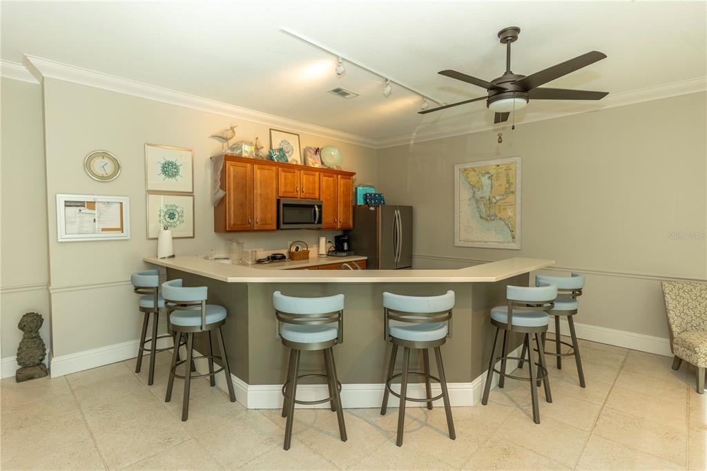 9203 Griggs Road, Unit B102 Englewood, FL 34224 - Photo 43 of 66 a view of a dining room with furniture