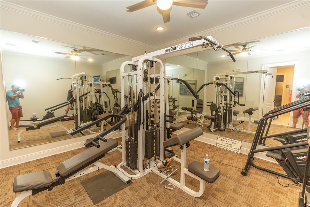 9203 Griggs Road, Unit B102 Englewood, FL 34224 - Photo 44 of 66 a view of a room with gym equipment