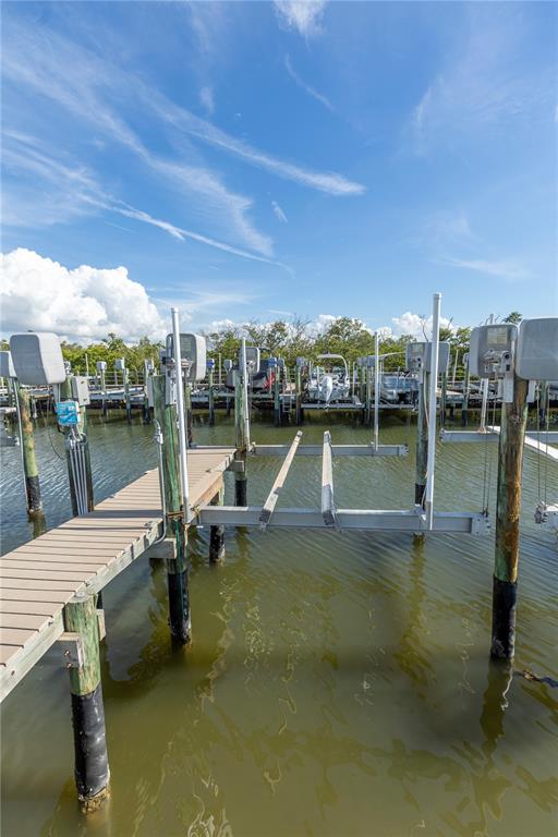 9203 Griggs Road, Unit B102 Englewood, FL 34224 - Photo 46 of 66 a view of a swimming pool with a lake view