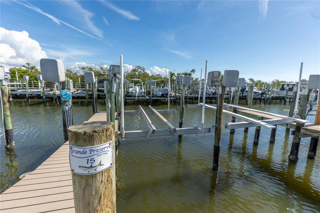 9203 Griggs Road, Unit B102 Englewood, FL 34224 - Photo 47 of 66 a view of a lake with boats and a bridge
