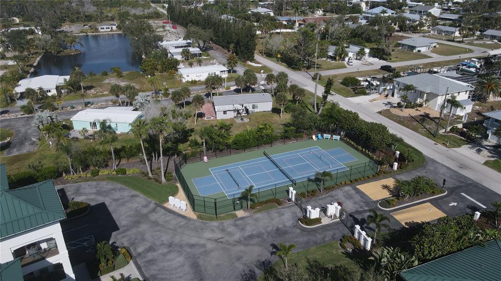 9203 Griggs Road, Unit B102 Englewood, FL 34224 - Photo 49 of 66 an aerial view of a house with a yard