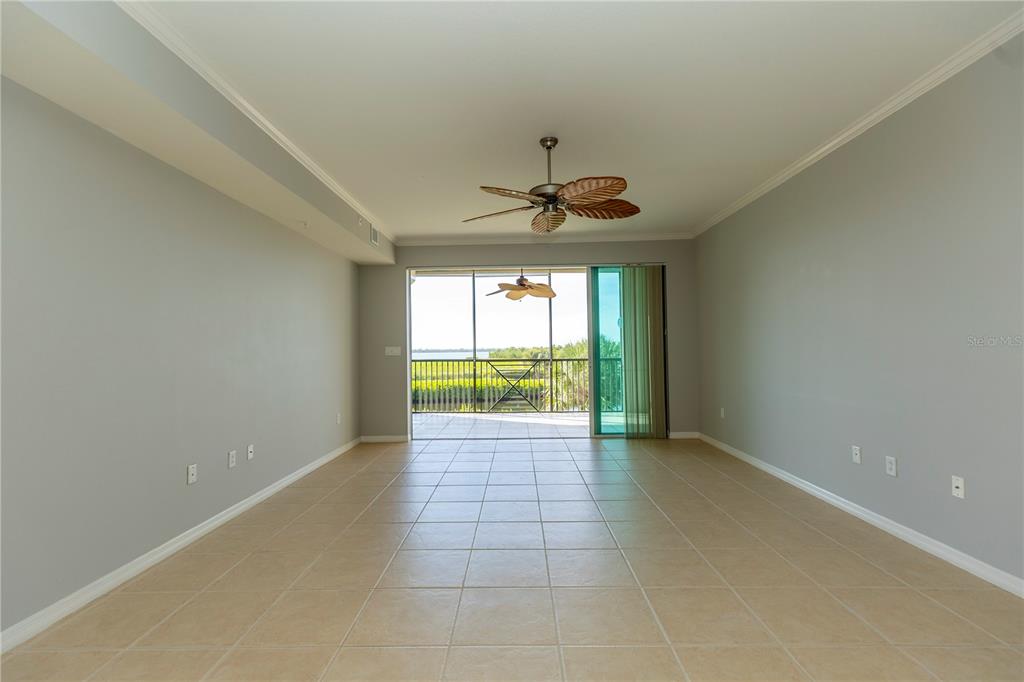 9203 Griggs Road, Unit B102 Englewood, FL 34224 - Photo 5 of 66 a view of an empty room and window