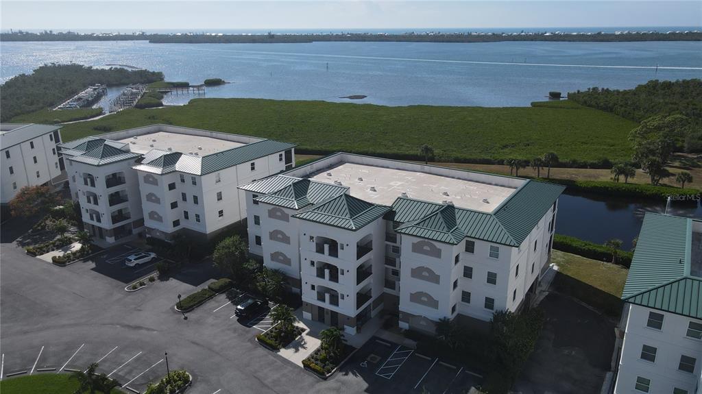 9203 Griggs Road, Unit B102 Englewood, FL 34224 - Photo 53 of 66 an aerial view of a house with a lake view