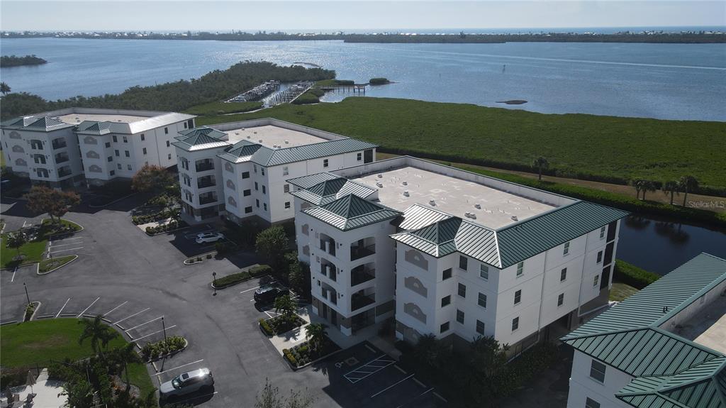 9203 Griggs Road, Unit B102 Englewood, FL 34224 - Photo 54 of 66 an aerial view of a house with a lake view