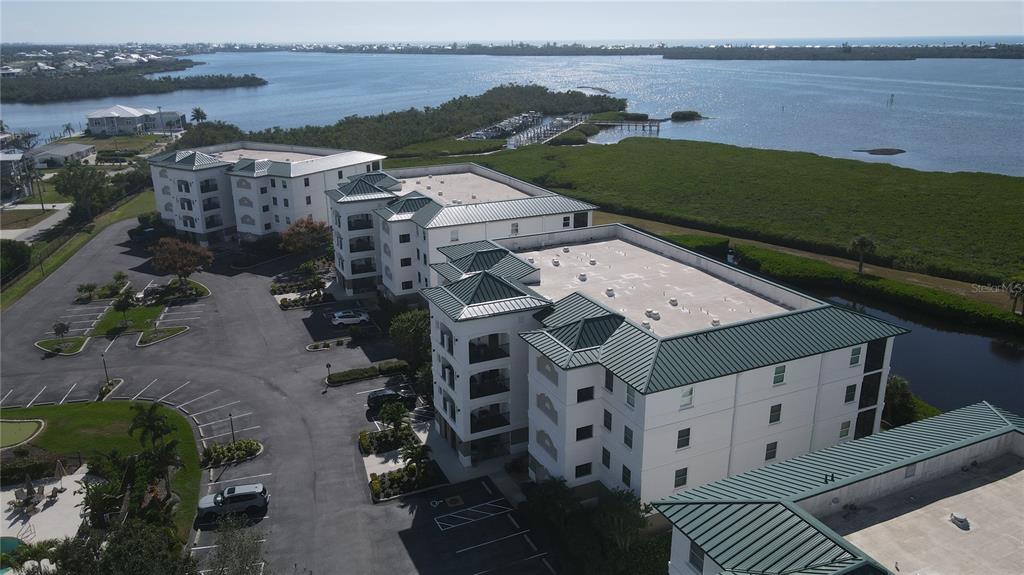 9203 Griggs Road, Unit B102 Englewood, FL 34224 - Photo 55 of 66 an aerial view of a house with a lake view