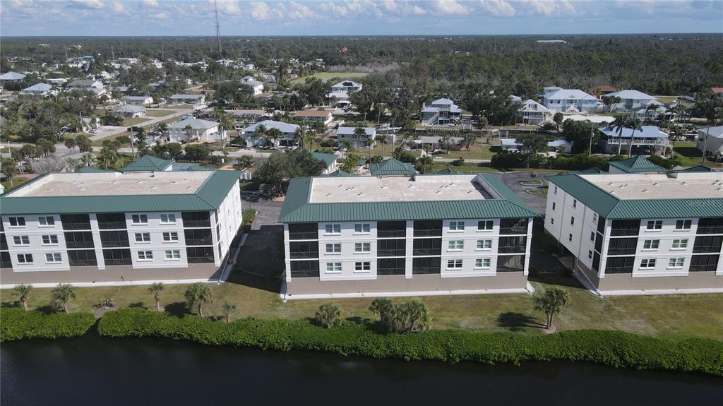 9203 Griggs Road, Unit B102 Englewood, FL 34224 - Photo 57 of 66 an aerial view of a house with a garden view