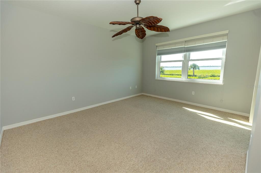 9203 Griggs Road, Unit B102 Englewood, FL 34224 - Photo 6 of 66 an empty room with a window