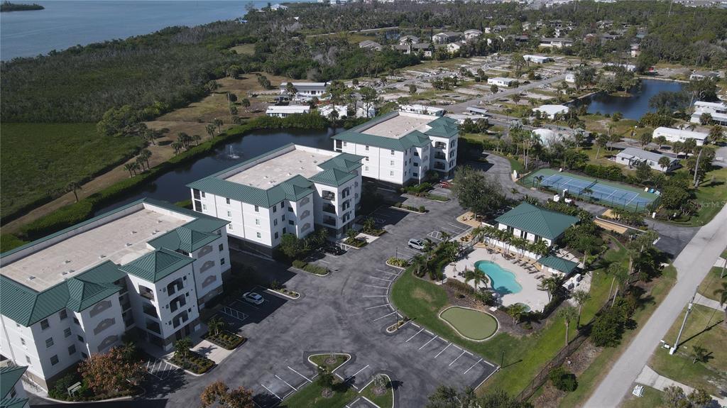 9203 Griggs Road, Unit B102 Englewood, FL 34224 - Photo 65 of 66 an aerial view of residential houses with outdoor space