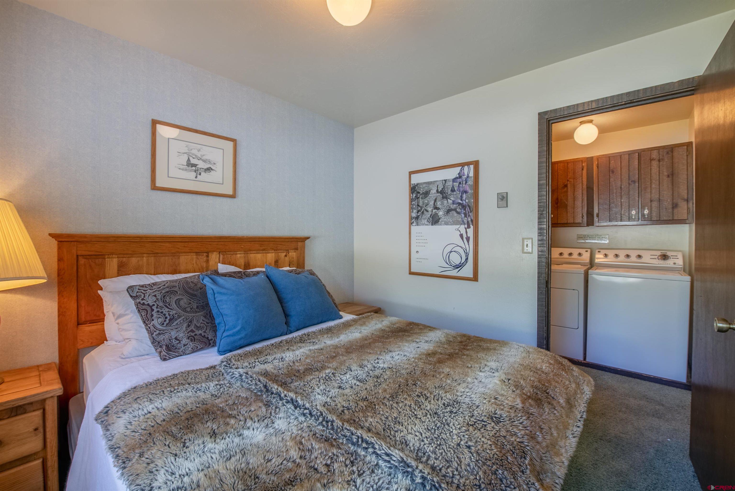 721 Gothic Road, Unit C3 Crested Butte, CO 81225 - Photo 15 of 33 a bedroom with a bed and a window