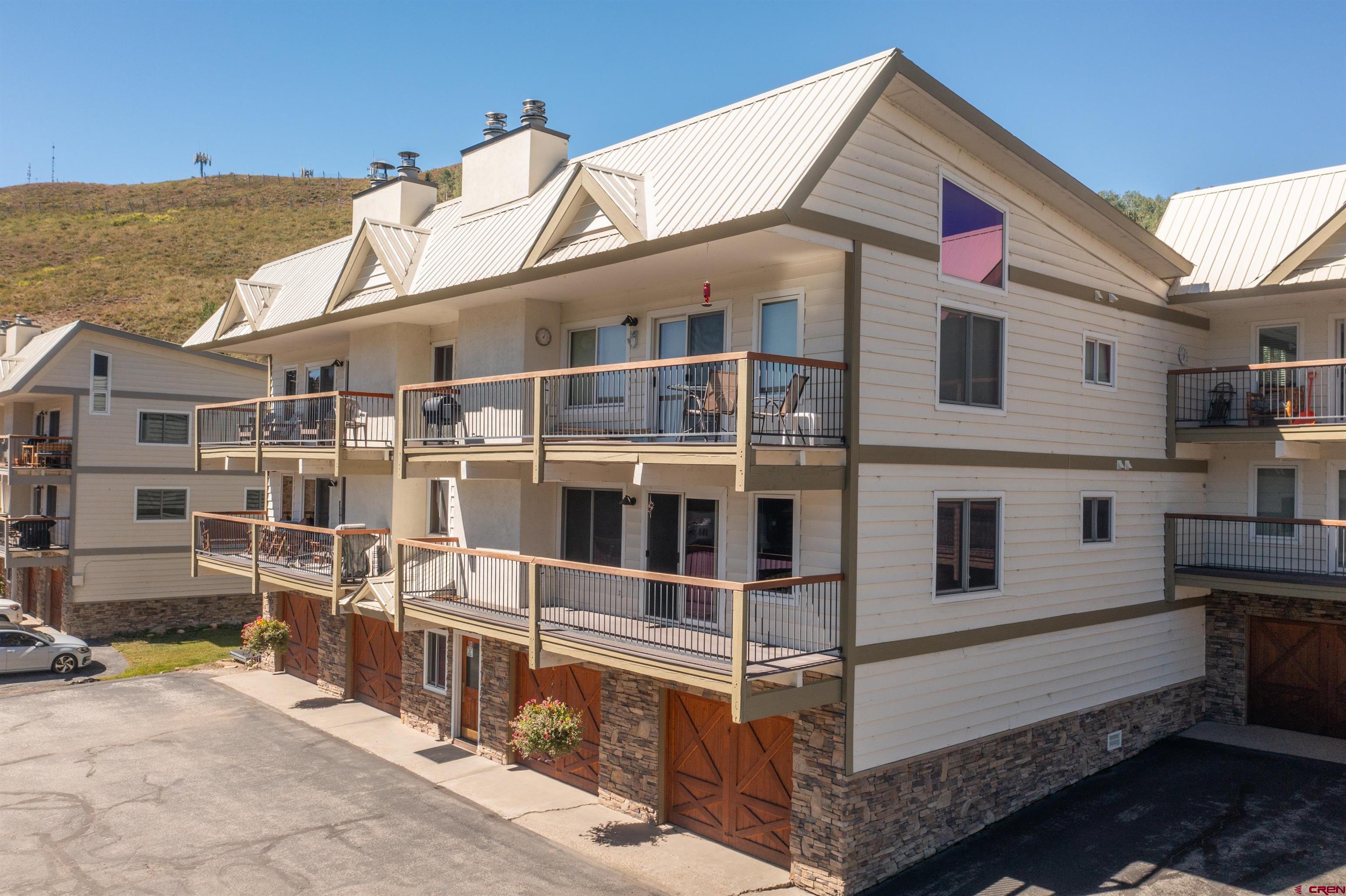 721 Gothic Road, Unit C3 Crested Butte, CO 81225 - Photo 25 of 33 a view of a white building with large windows