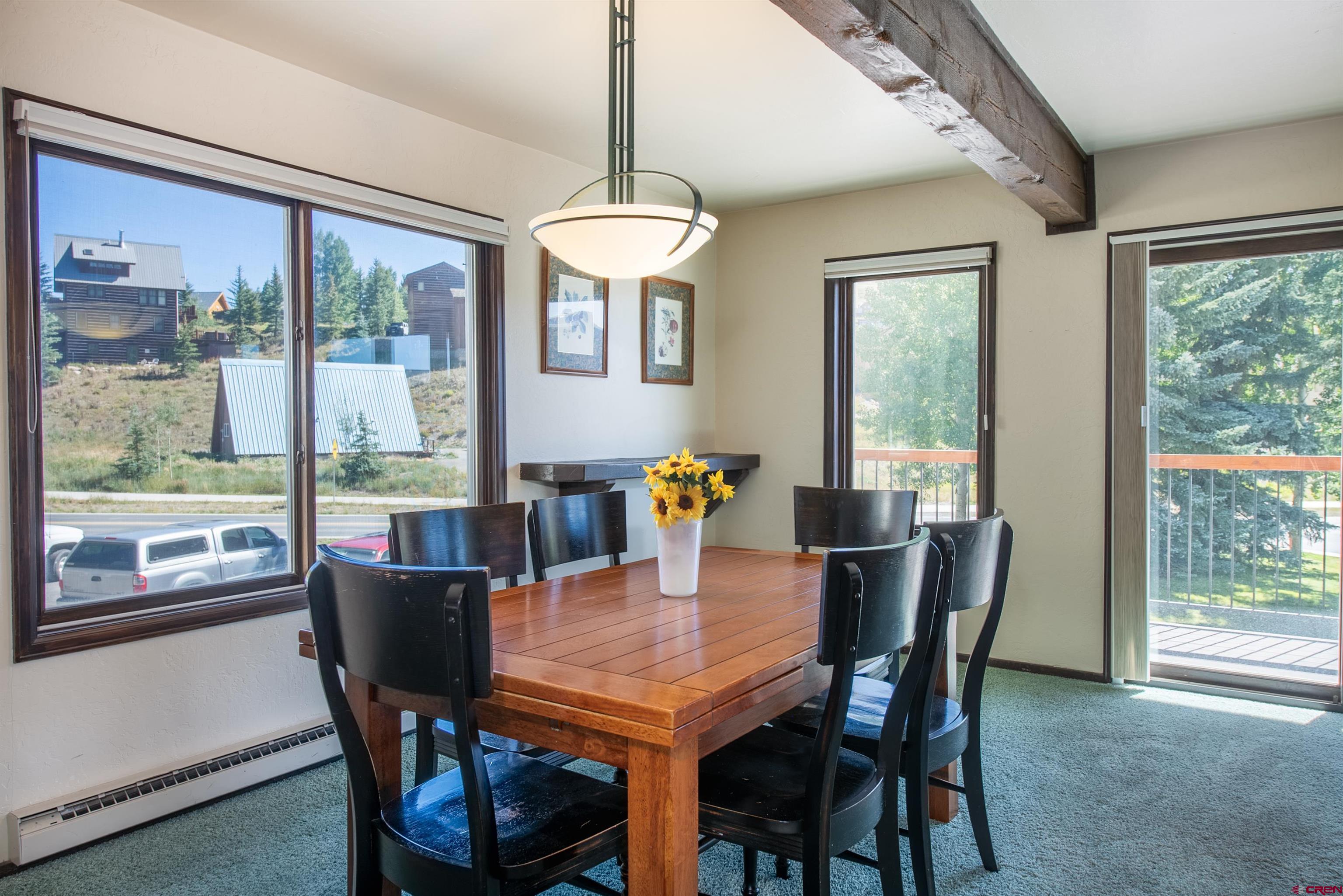 721 Gothic Road, Unit C3 Crested Butte, CO 81225 - Photo 3 of 33 a view of a dining room with furniture window and outside view