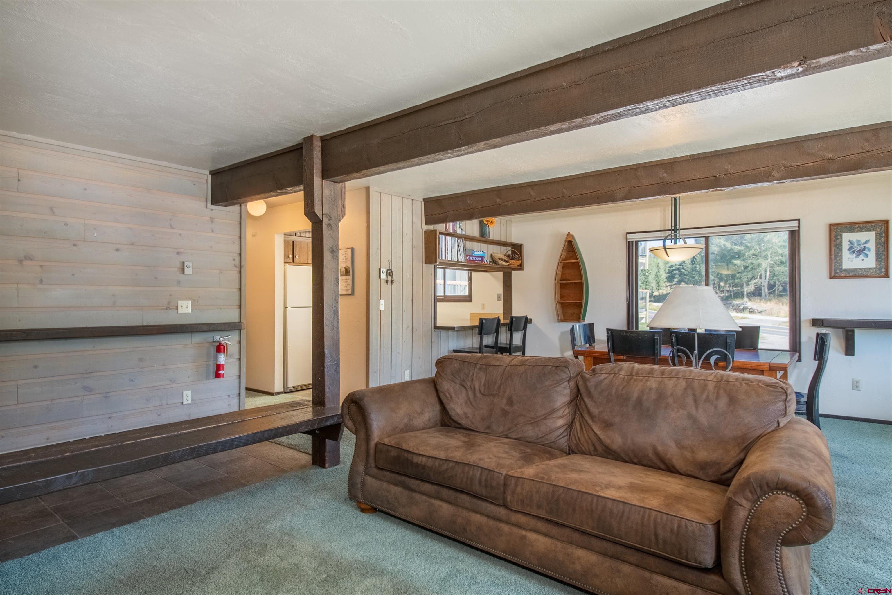 721 Gothic Road, Unit C3 Crested Butte, CO 81225 - Photo 7 of 33 a living room with furniture and a large window