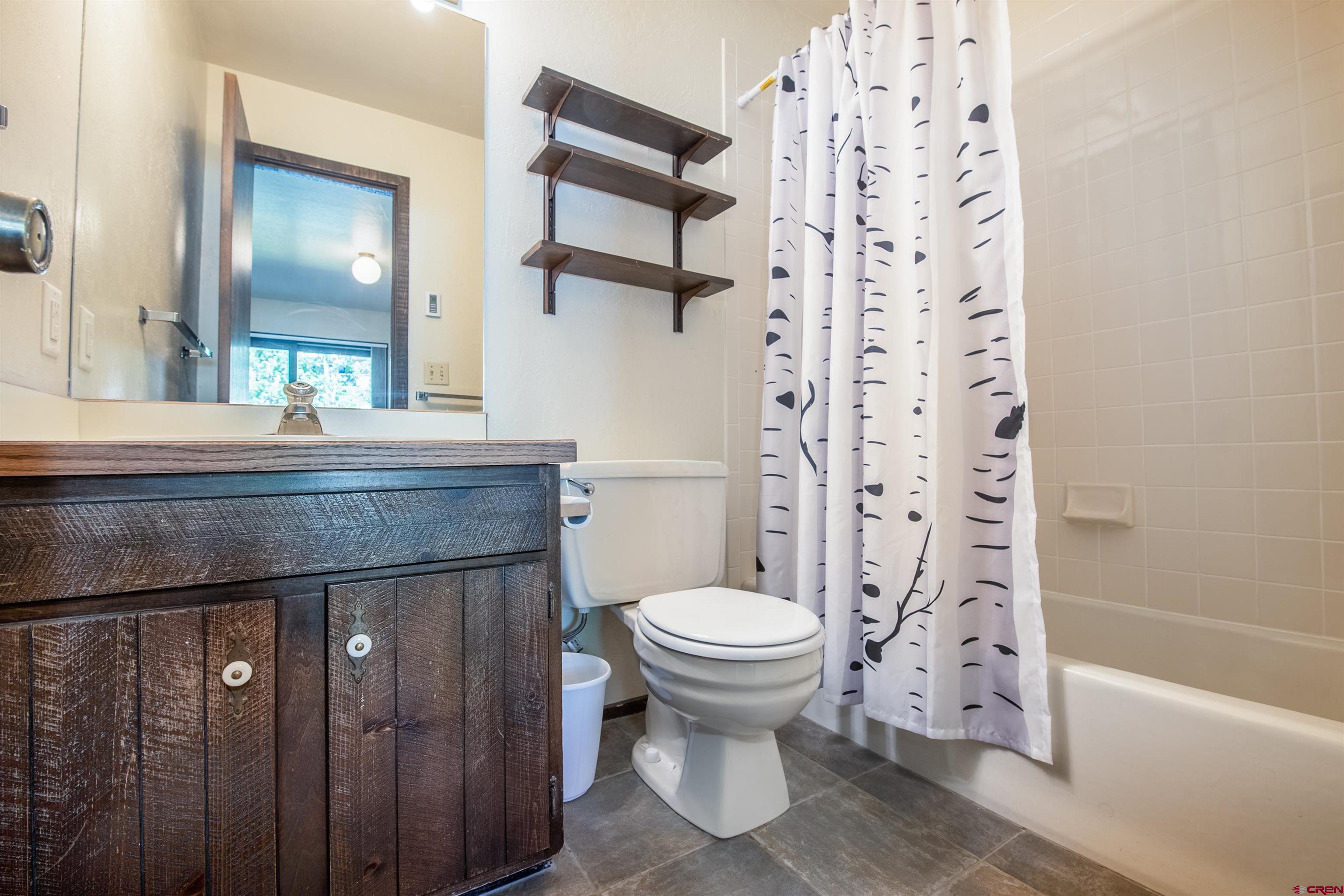 721 Gothic Road, Unit C3 Crested Butte, CO 81225 - Photo 10 of 33 a bathroom with a sink toilet and shower