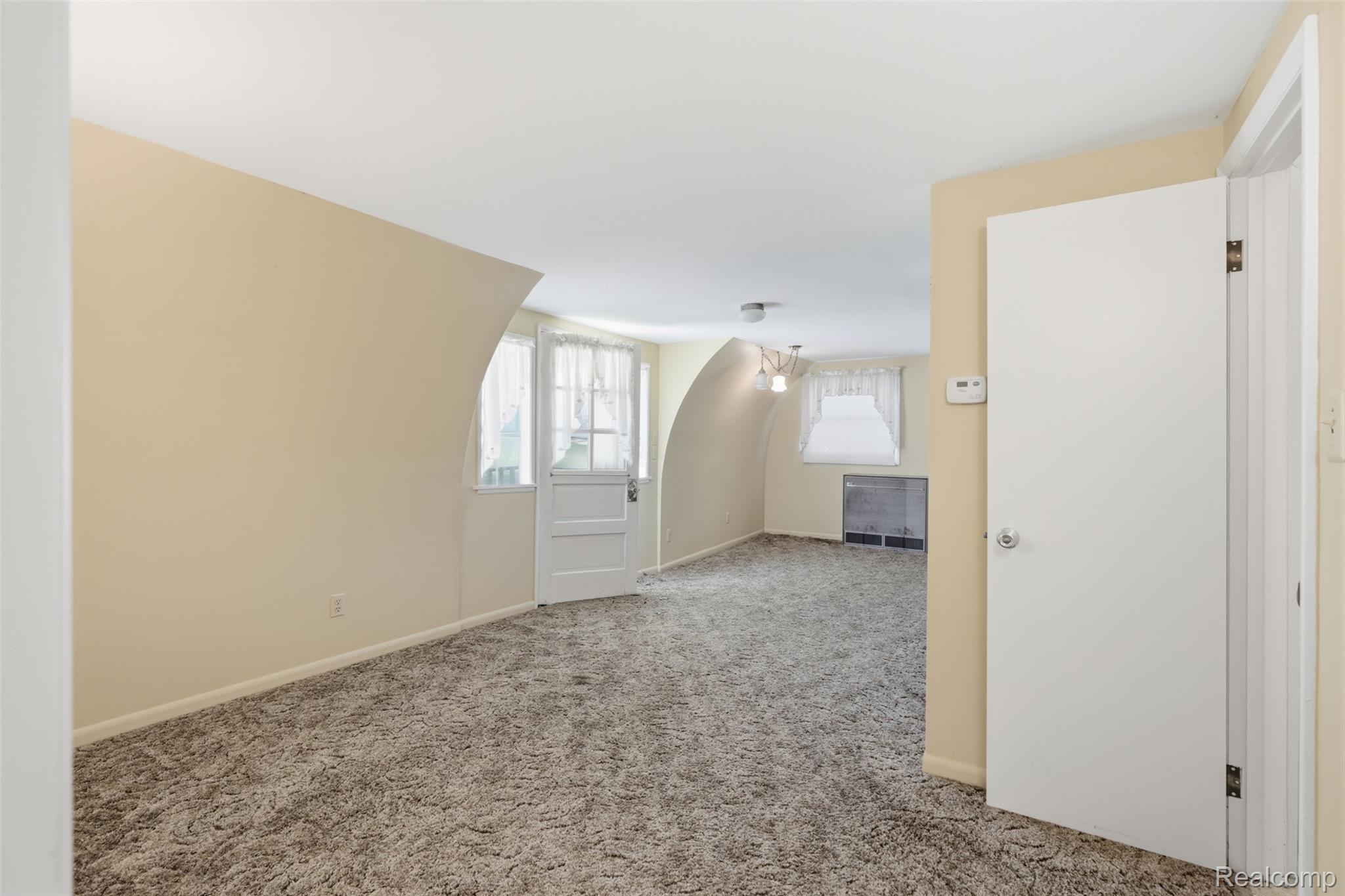 8636 Tindall Road Davisburg, MI 48350 - Photo 50 of 61 Additional living space featuring light colored carpet and baseboards