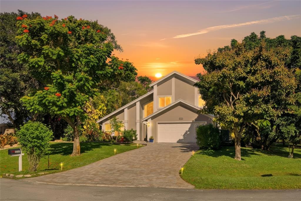 a view of a house with a yard