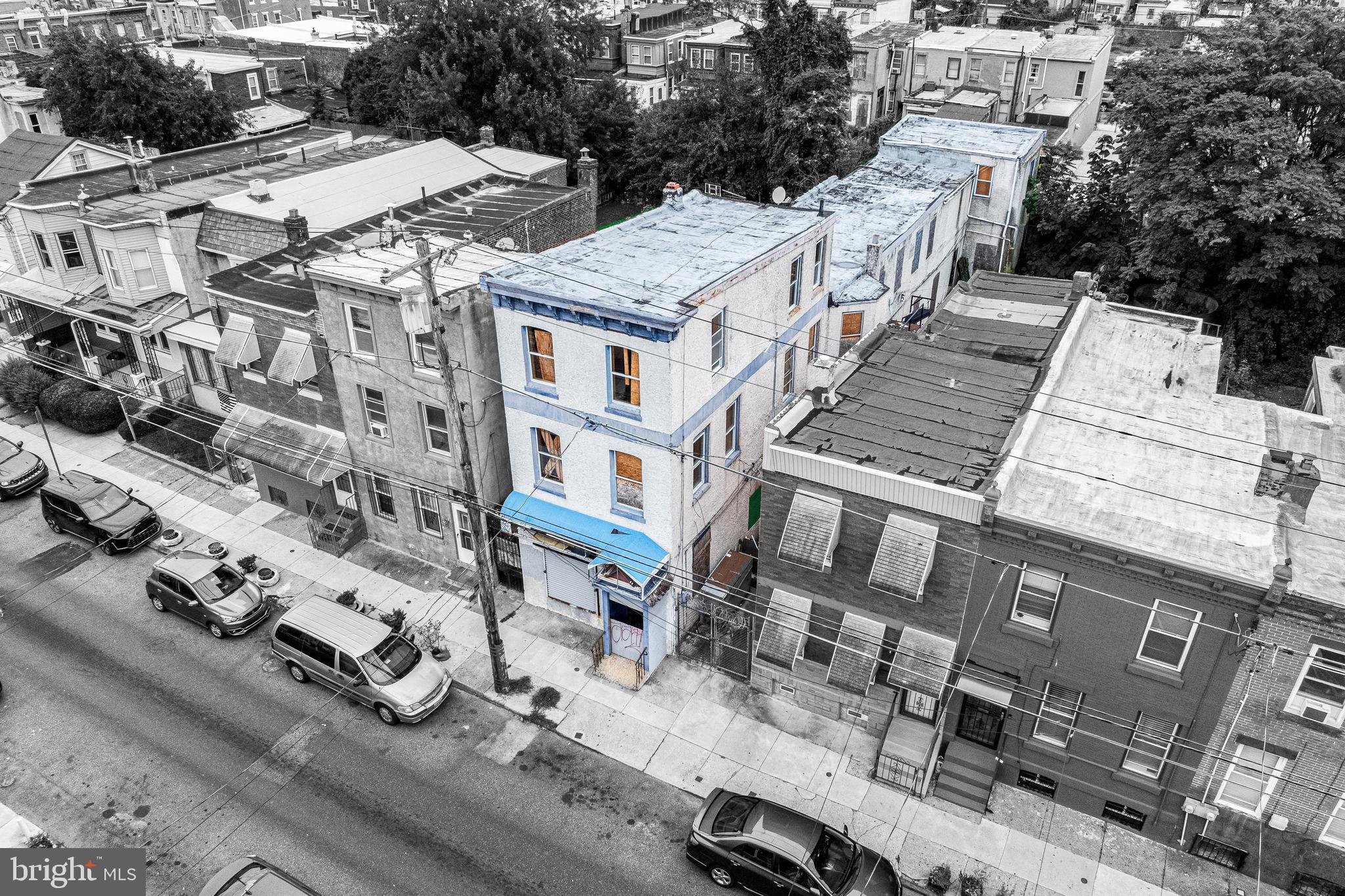 3533 North 6th Street Philadelphia, PA 19140 - Photo 4 of 31 a view of a white building among the city street