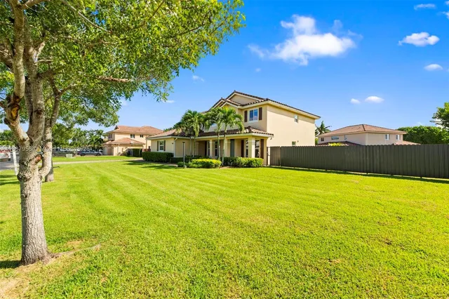 a front view of house with yard and outdoor seating