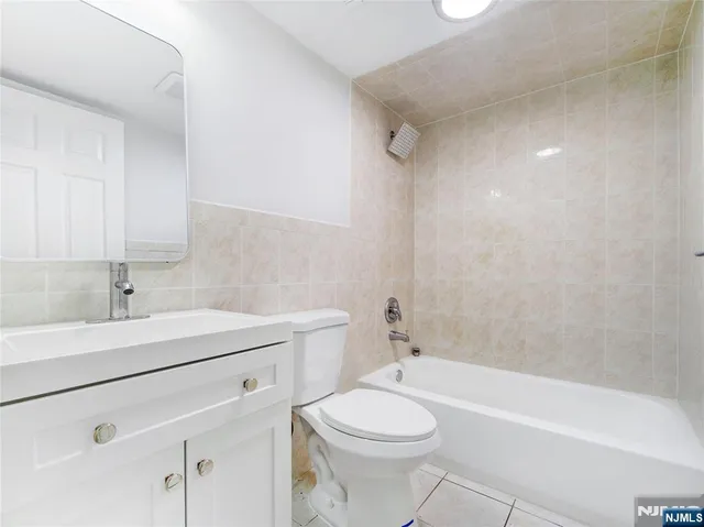 a bathroom with a sink a toilet and a bathtub