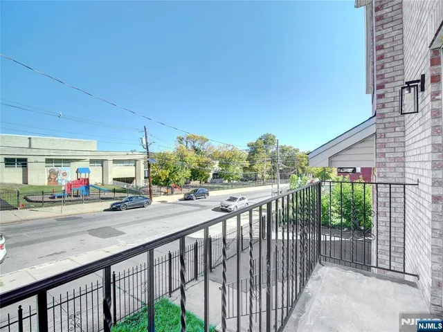 a view of a street from a balcony