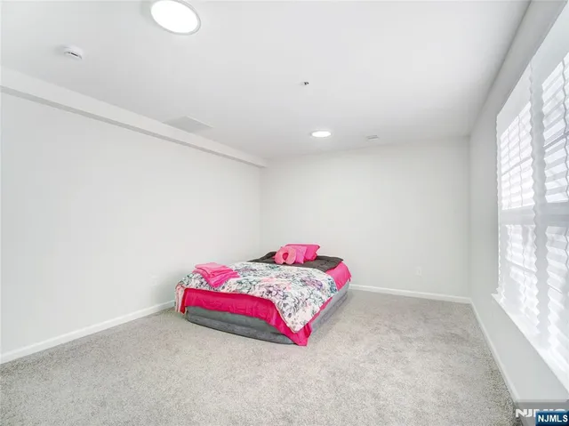 a room with a bed and a window