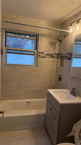 a bathroom with a sink and a bathtub