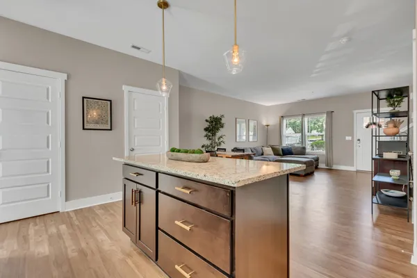 a kitchen with a sink stove and microwave