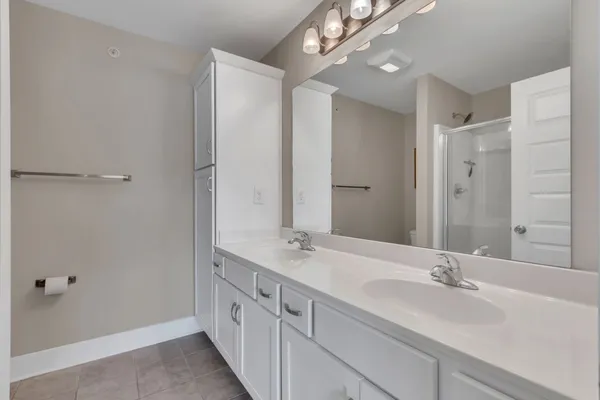 a bathroom with a glass shower door