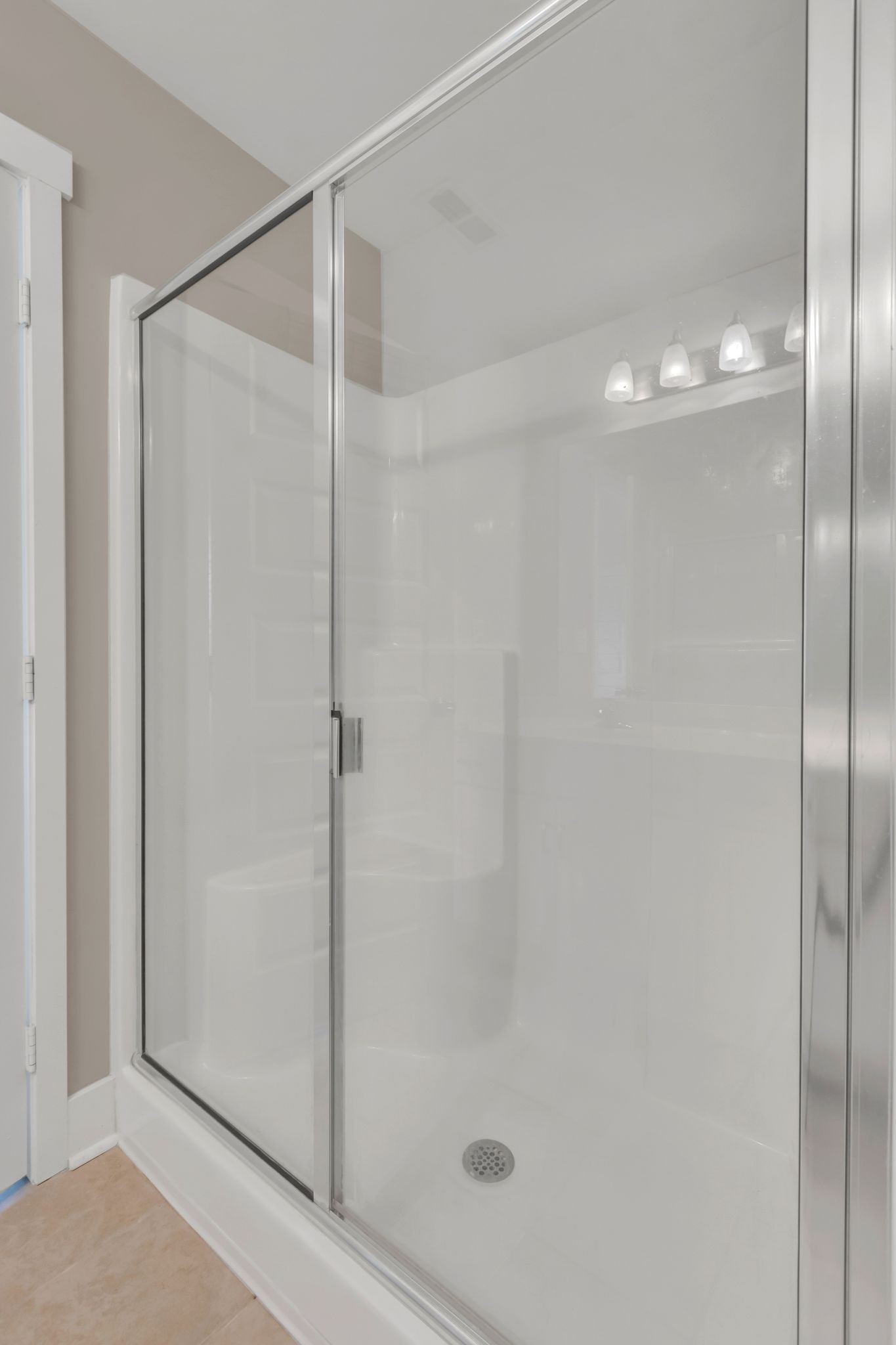 4004 Currant Court Spring Hill, TN 37174 - Photo 19 of 27 a bathroom with a glass shower door