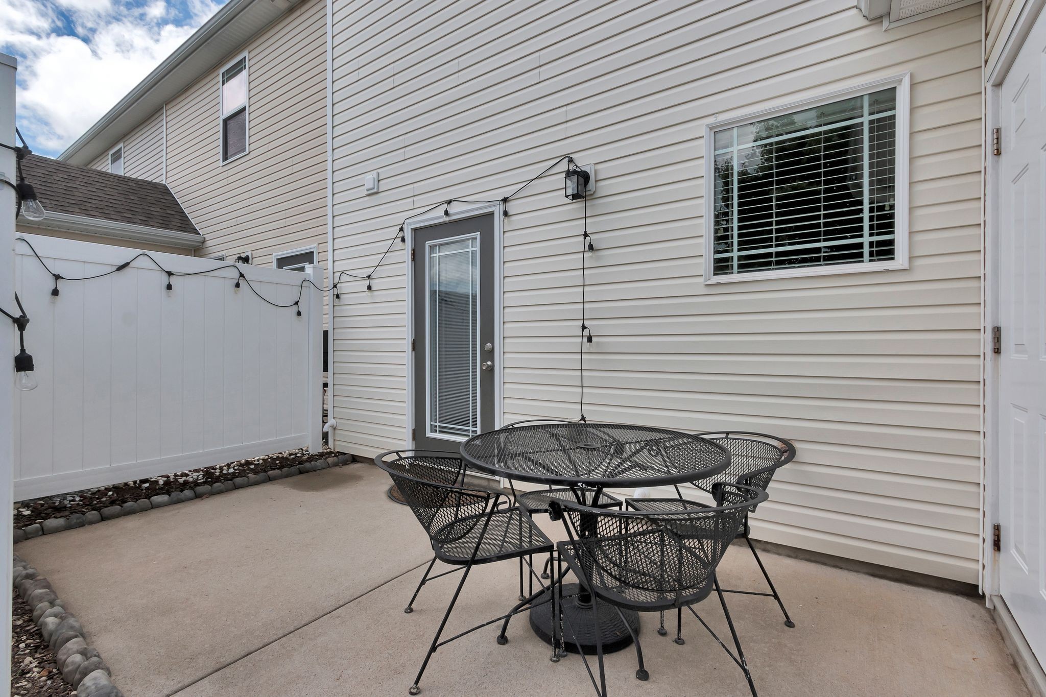 4004 Currant Court Spring Hill, TN 37174 - Photo 24 of 27 a view of a patio with table and chairs with wooden floor and fence