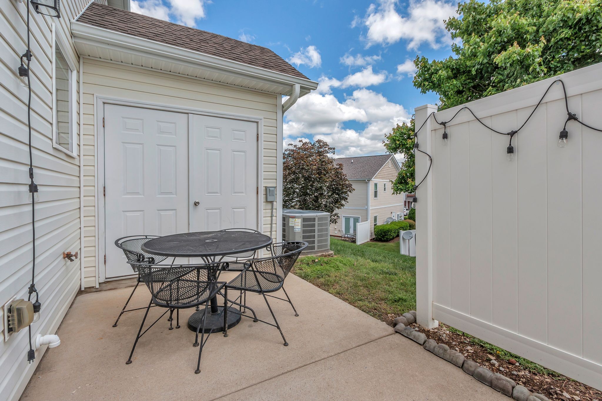 4004 Currant Court Spring Hill, TN 37174 - Photo 25 of 27 a view of a backyard with table and chairs and potted plants