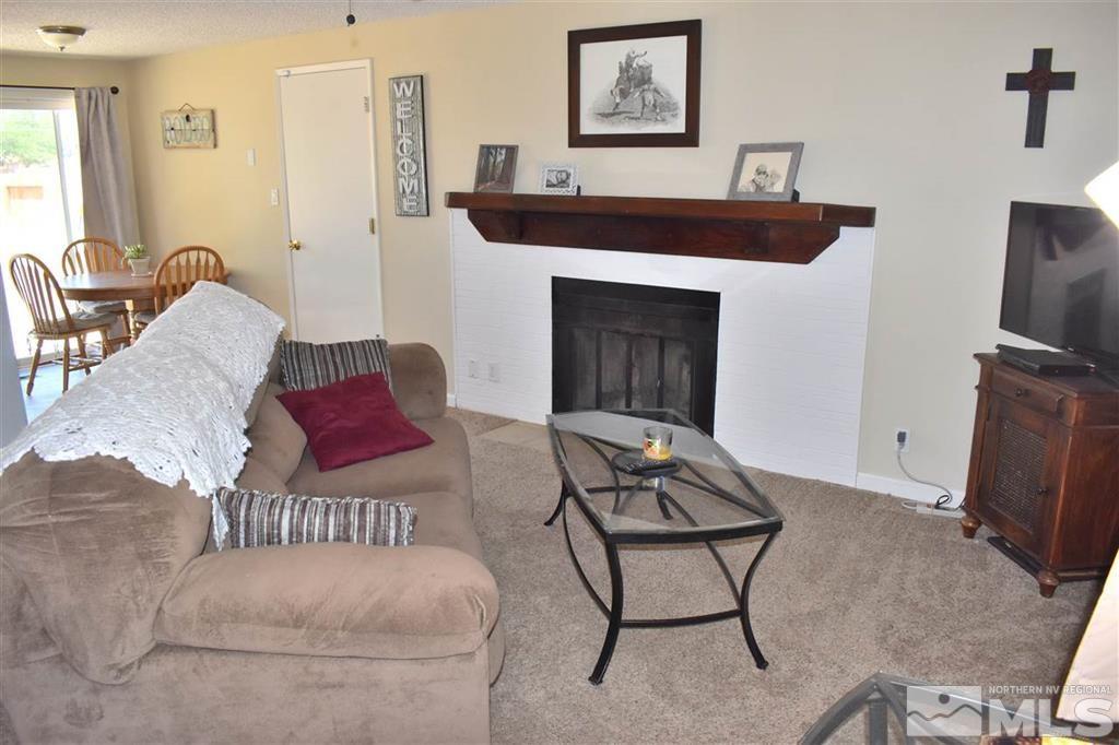 9185 Fremont Way Reno, NV 89506 - Photo 6 of 10 a living room with furniture and a fireplace