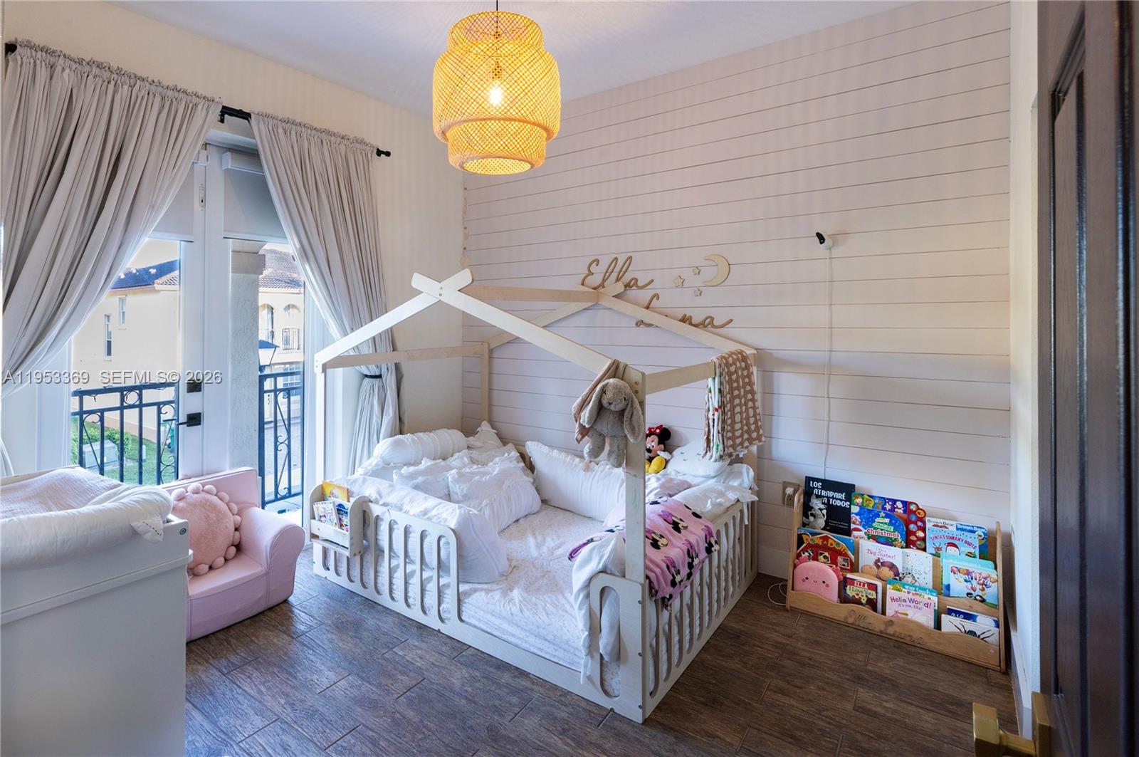 13276 Southwest 128th Street Miami, FL 33186 - Photo 11 of 43 a bedroom with furniture and a wooden floor