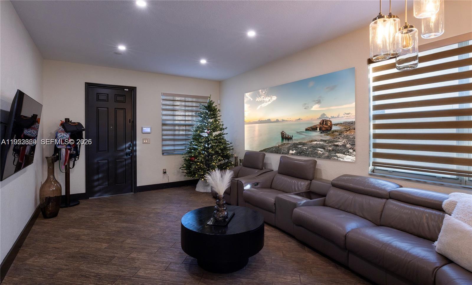 13276 Southwest 128th Street Miami, FL 33186 - Photo 2 of 43 a living room with furniture and a flat screen tv