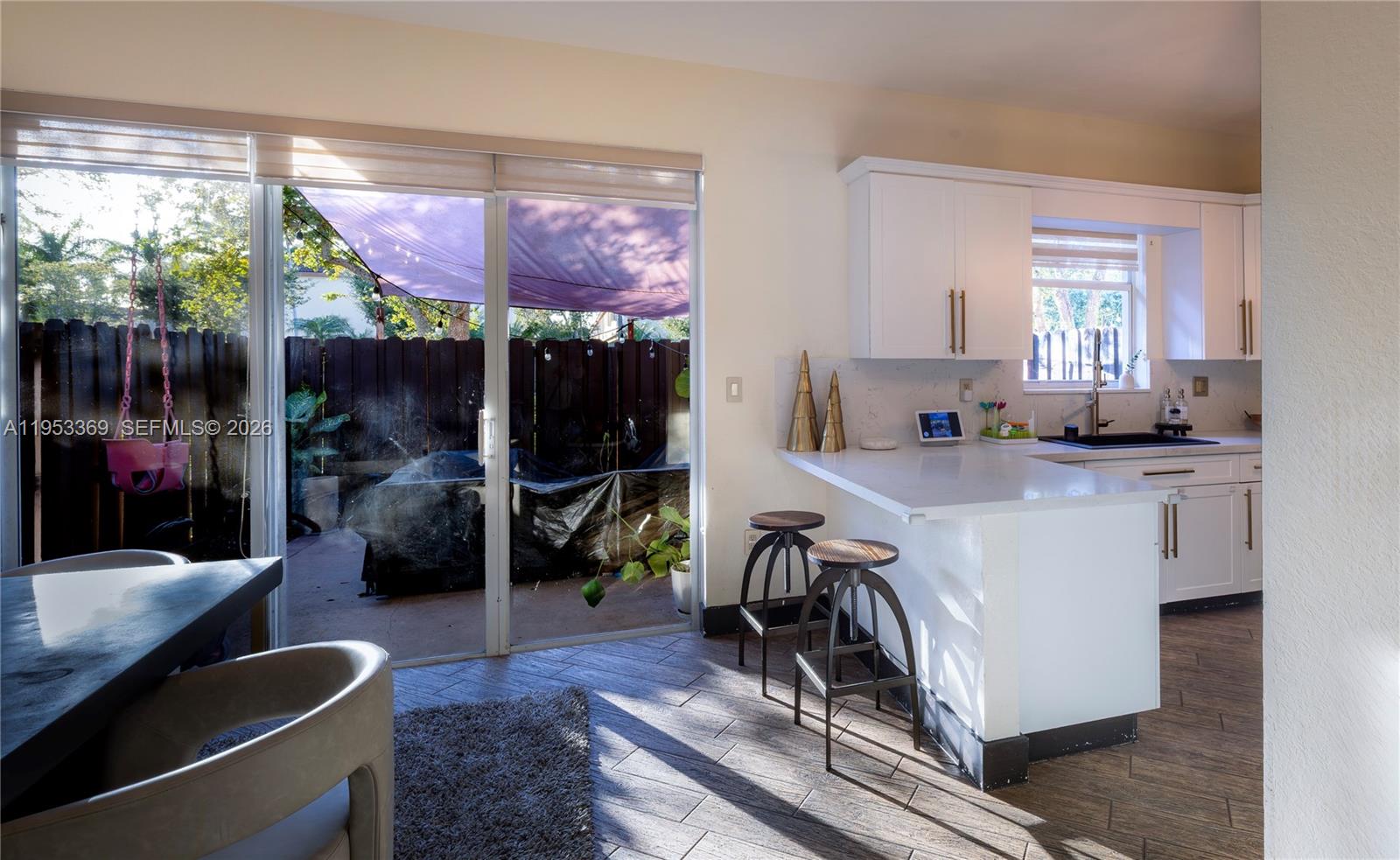 13276 Southwest 128th Street Miami, FL 33186 - Photo 4 of 43 a room with table and chairs