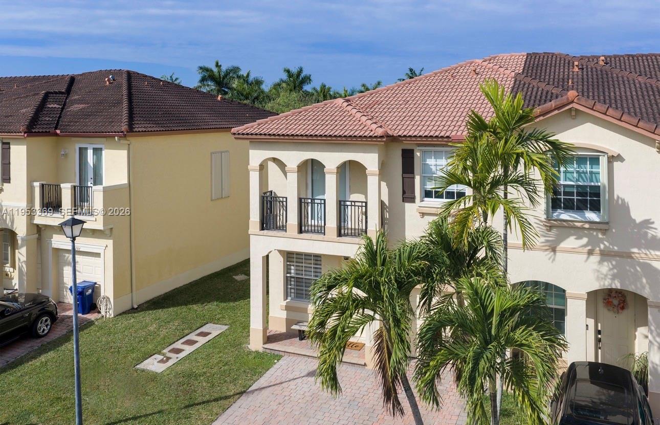 13276 Southwest 128th Street Miami, FL 33186 - Photo 42 of 43 a front view of a house with a yard