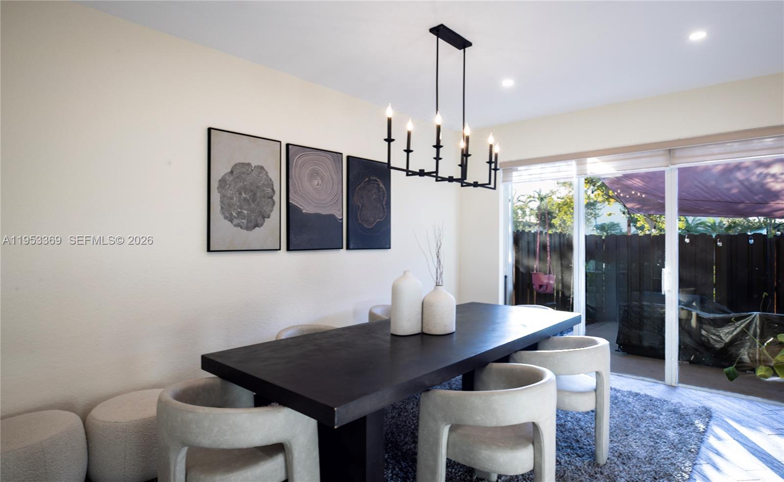 13276 Southwest 128th Street Miami, FL 33186 - Photo 5 of 43 a view of a dining room with furniture window and wooden floor